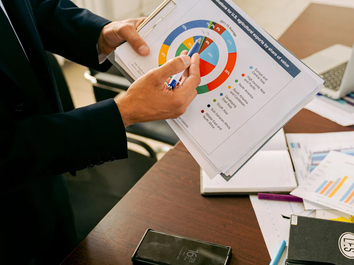Professionals reviewing a printed performance report