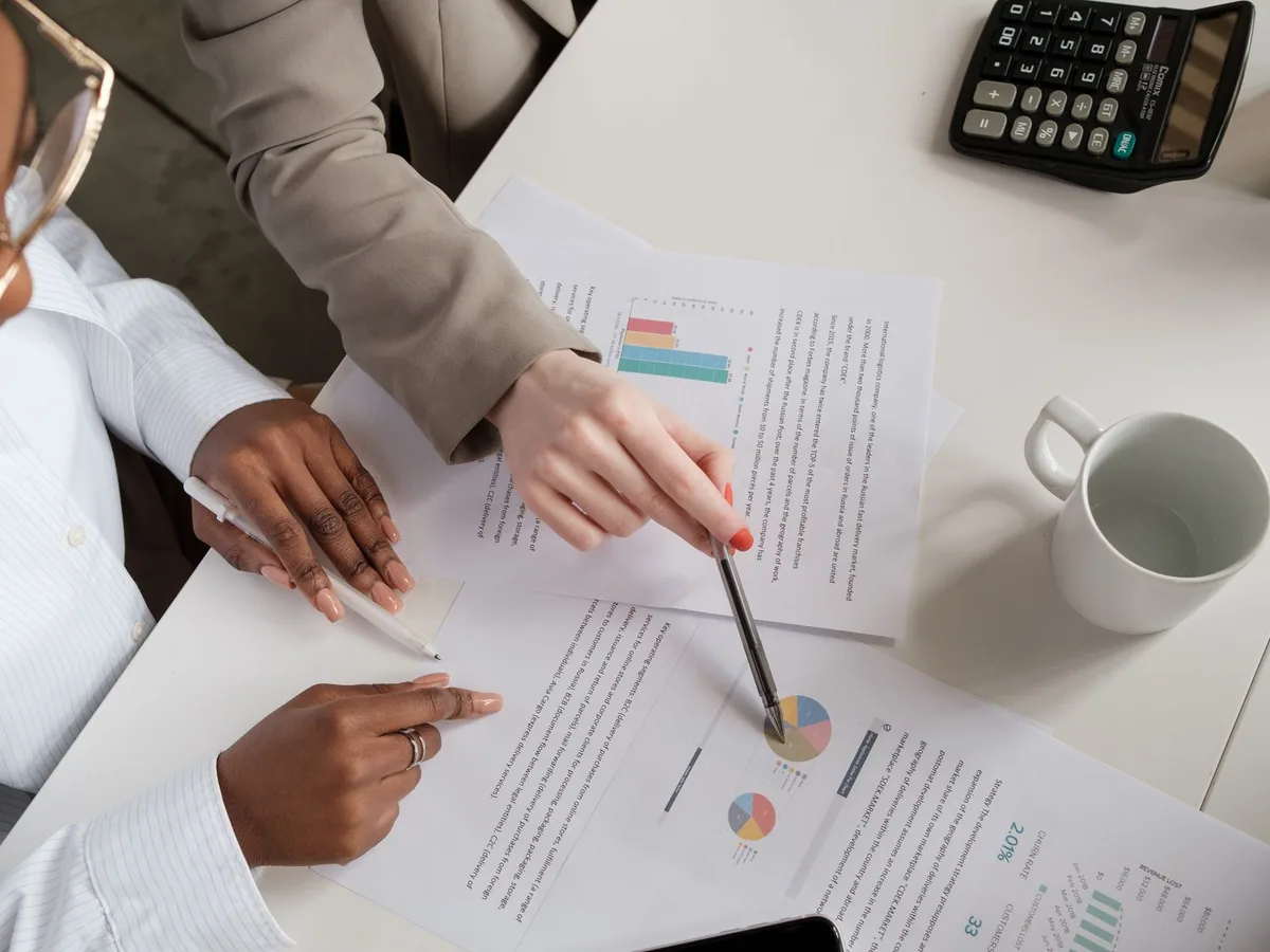 Professionals checking documents and charts during a meeting